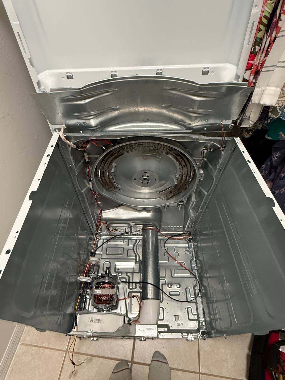 Dryer repair in progress in a Naples home